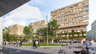 mehrere moderne Wohngebäude mit begrünten Fassaden umgeben einen öffentlichen Platz mit Bäumen und Menschen